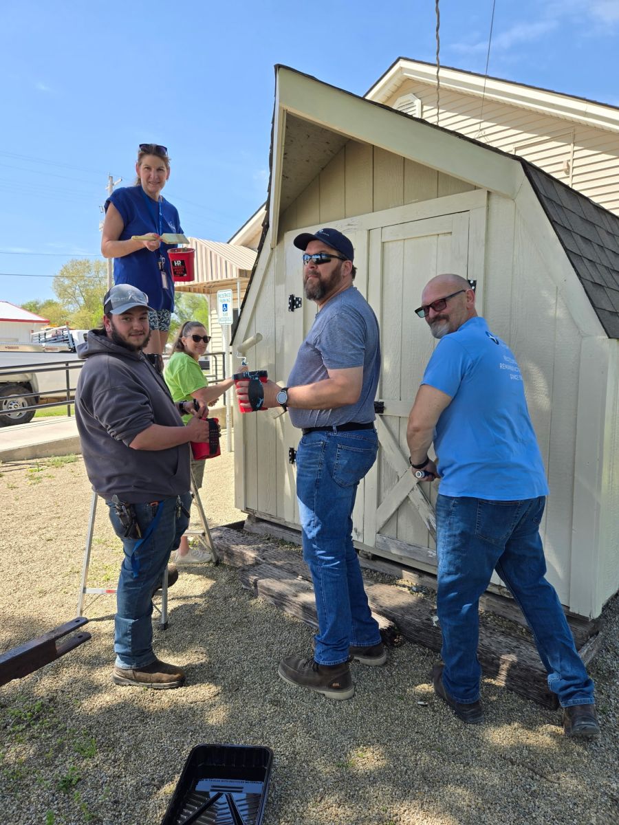 Sunbelt Solomon Volunteers Paint Friendship Center Shed