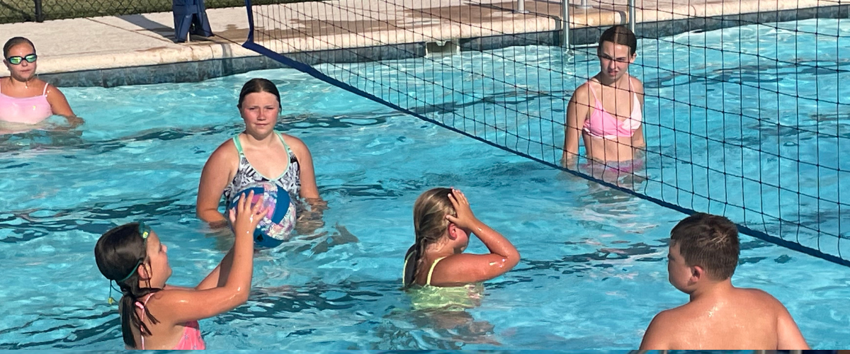 People playing volleyball at the Solomon Community Pool