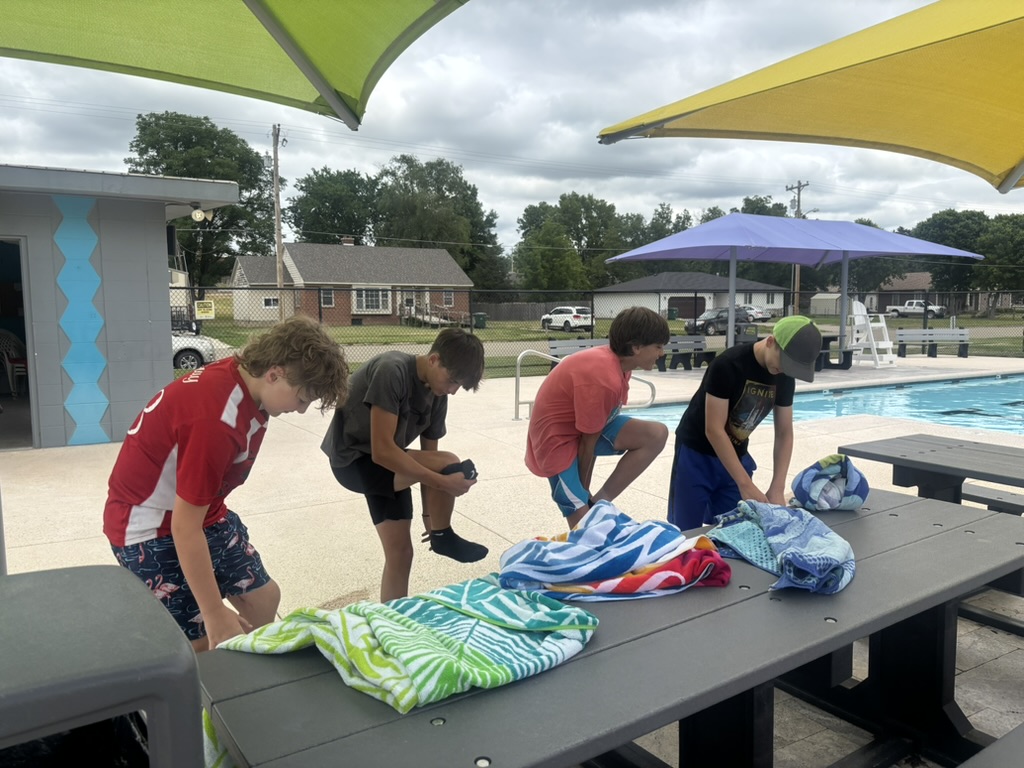 group of boys changing at the city pool